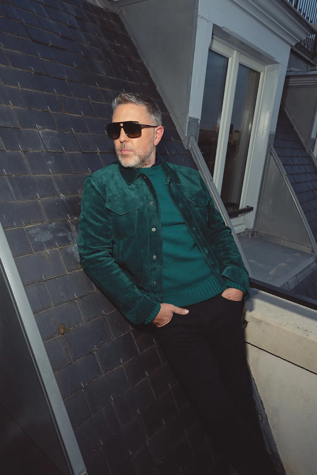 Posed menswear portrait in a green Tom Ford suede jacket