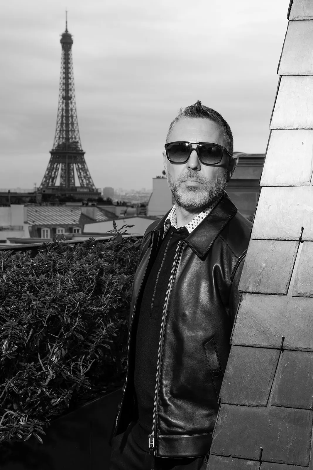 Black and white menswear portrait with the Eiffel Tower behind