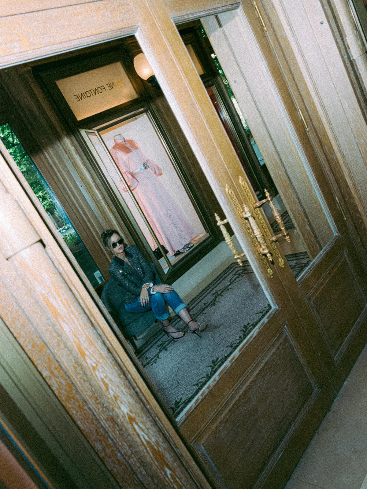 Couple reflected in a gilded mirror at the Ritz Paris