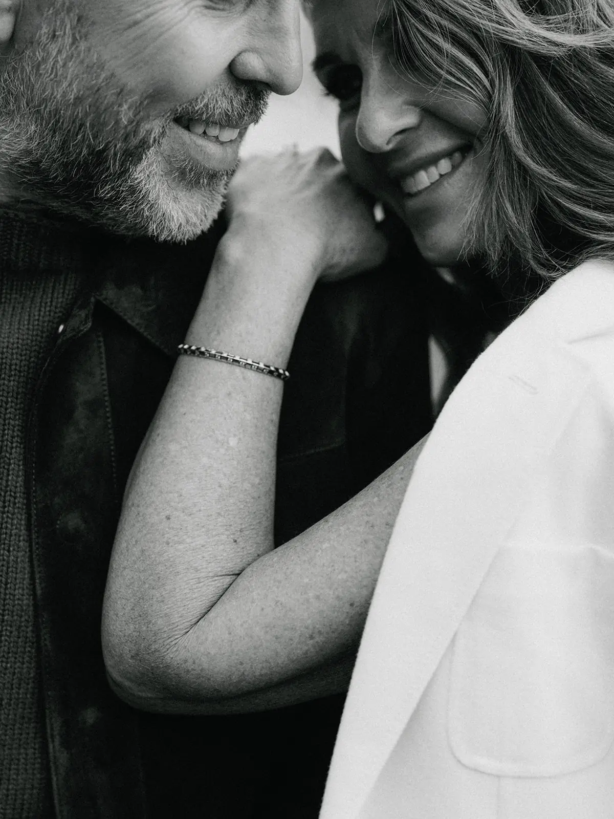 Intimate black and white close-up of the couple