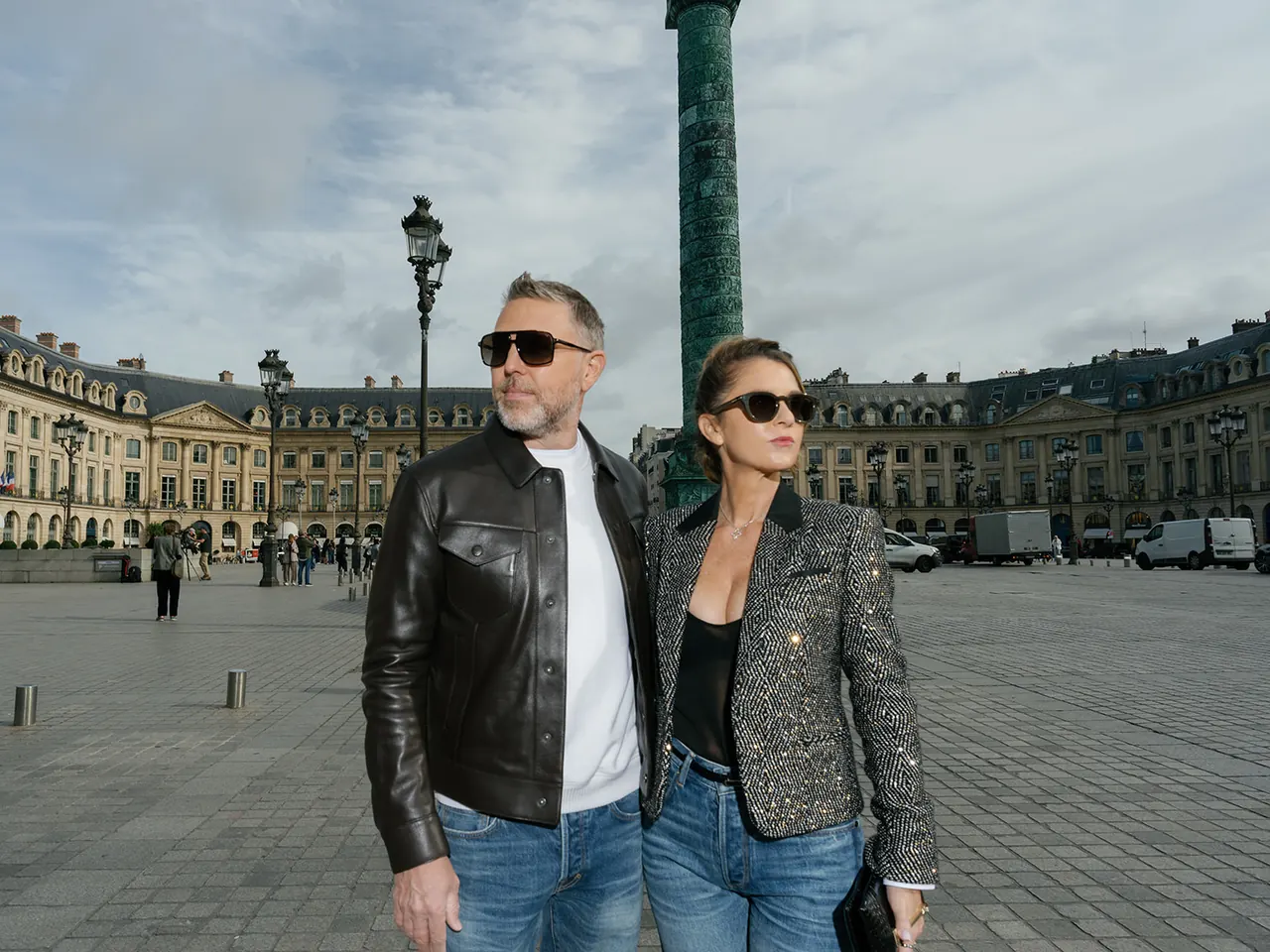 Posed couple portrait with the architecture of Place Vendôme behind