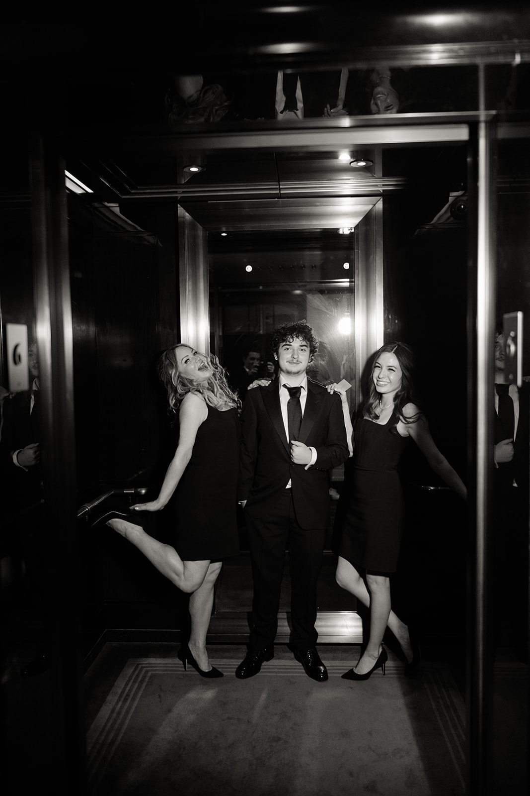 Playful evening portrait inside an elevator at The Peninsula Paris