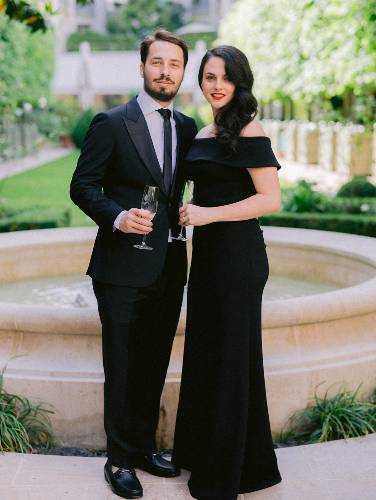 Editorial portrait of wedding guests in modern black-tie outfits