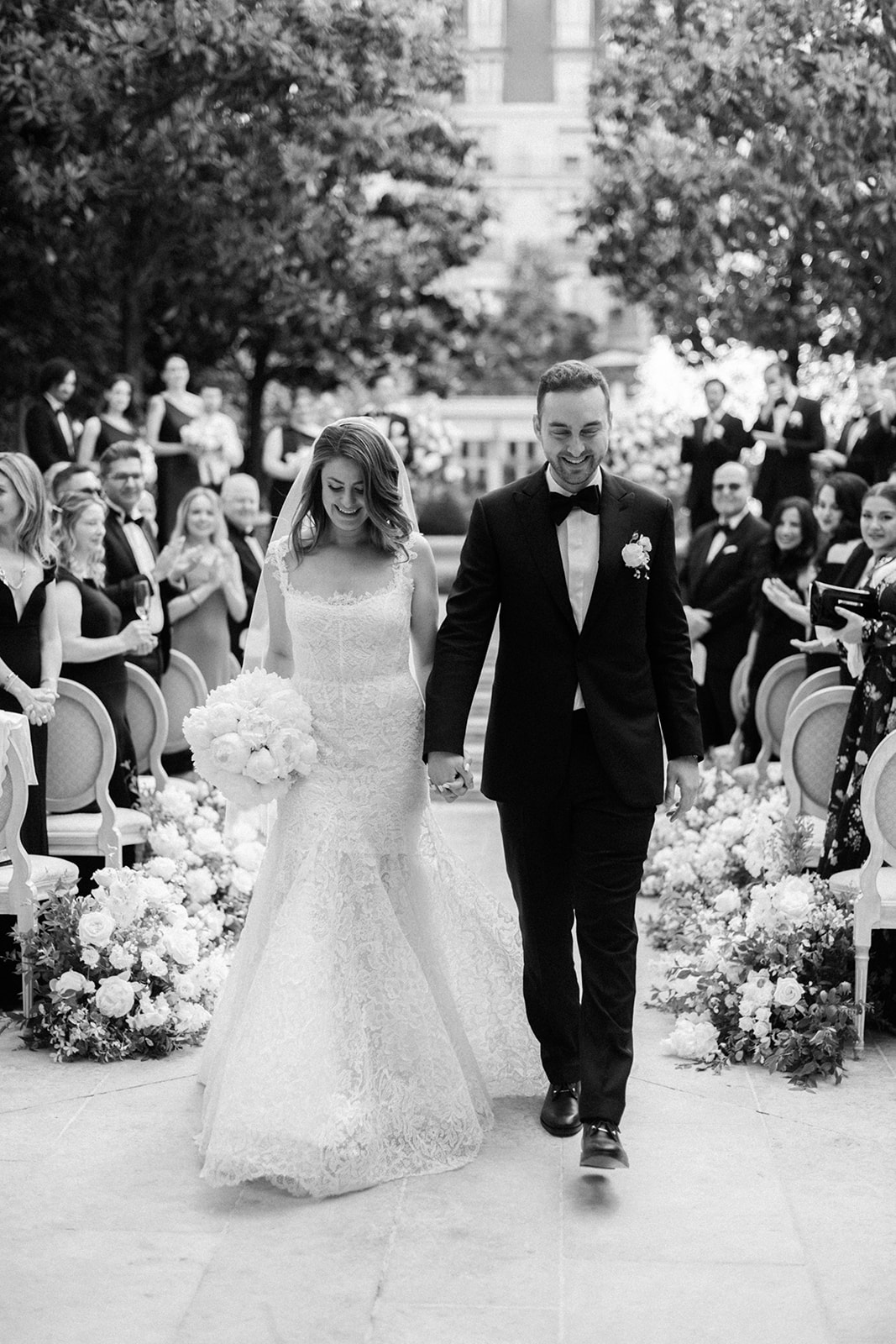 Newlywed couple walking down the aisle after a Paris wedding ceremony