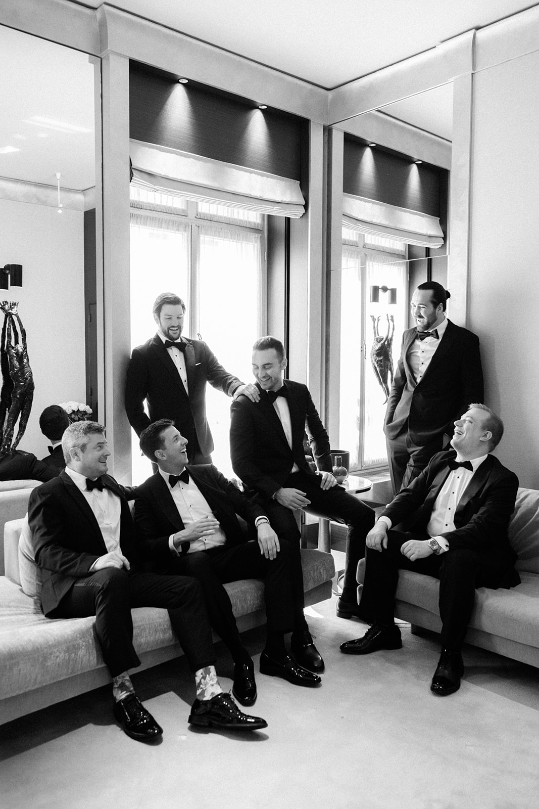 Groom and groomsmen getting ready in black tie at the Ritz Paris