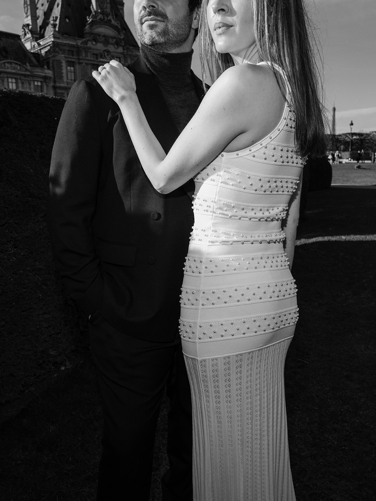Black-and-white direct-flash editorial couple portrait in the Tuileries Garden