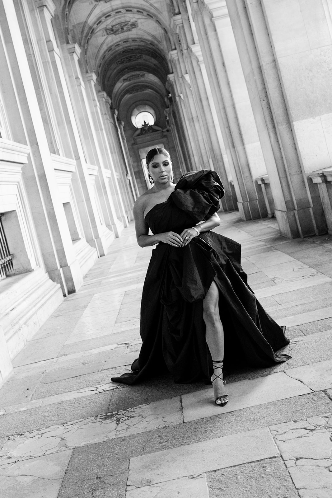 Couple photographed at the Louvre during an engagement session in Paris