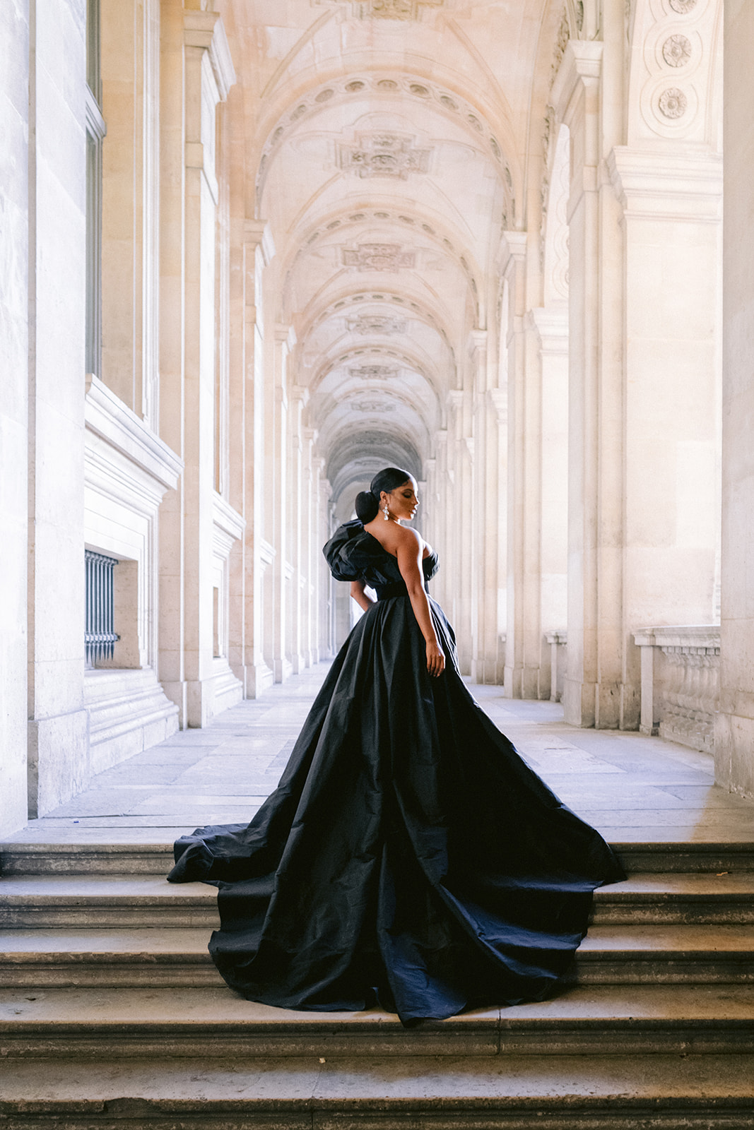 Couple photographed at the Louvre during an engagement session in Paris