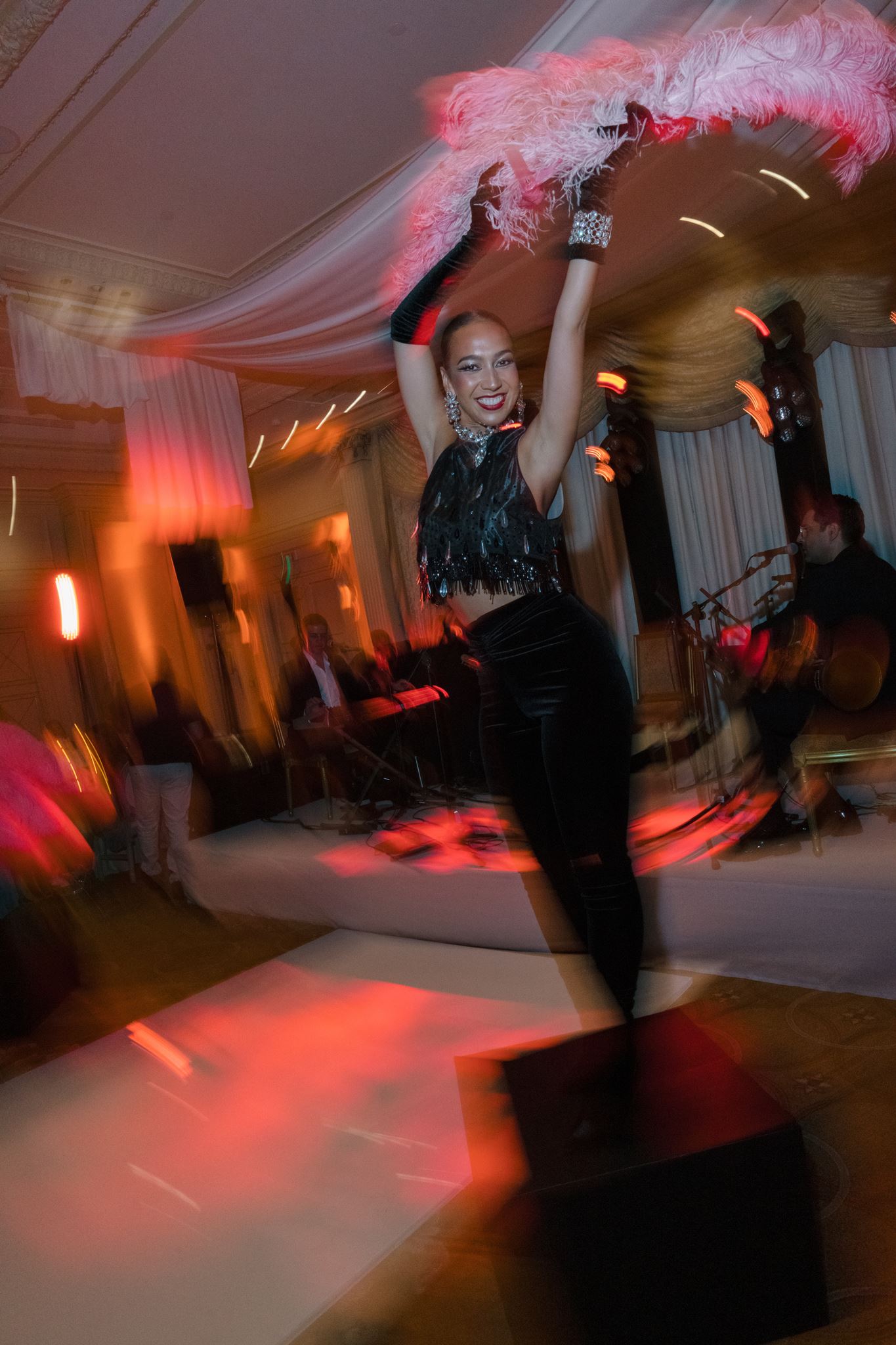 Evening party performer photographed with direct flash at an editorial wedding in Paris