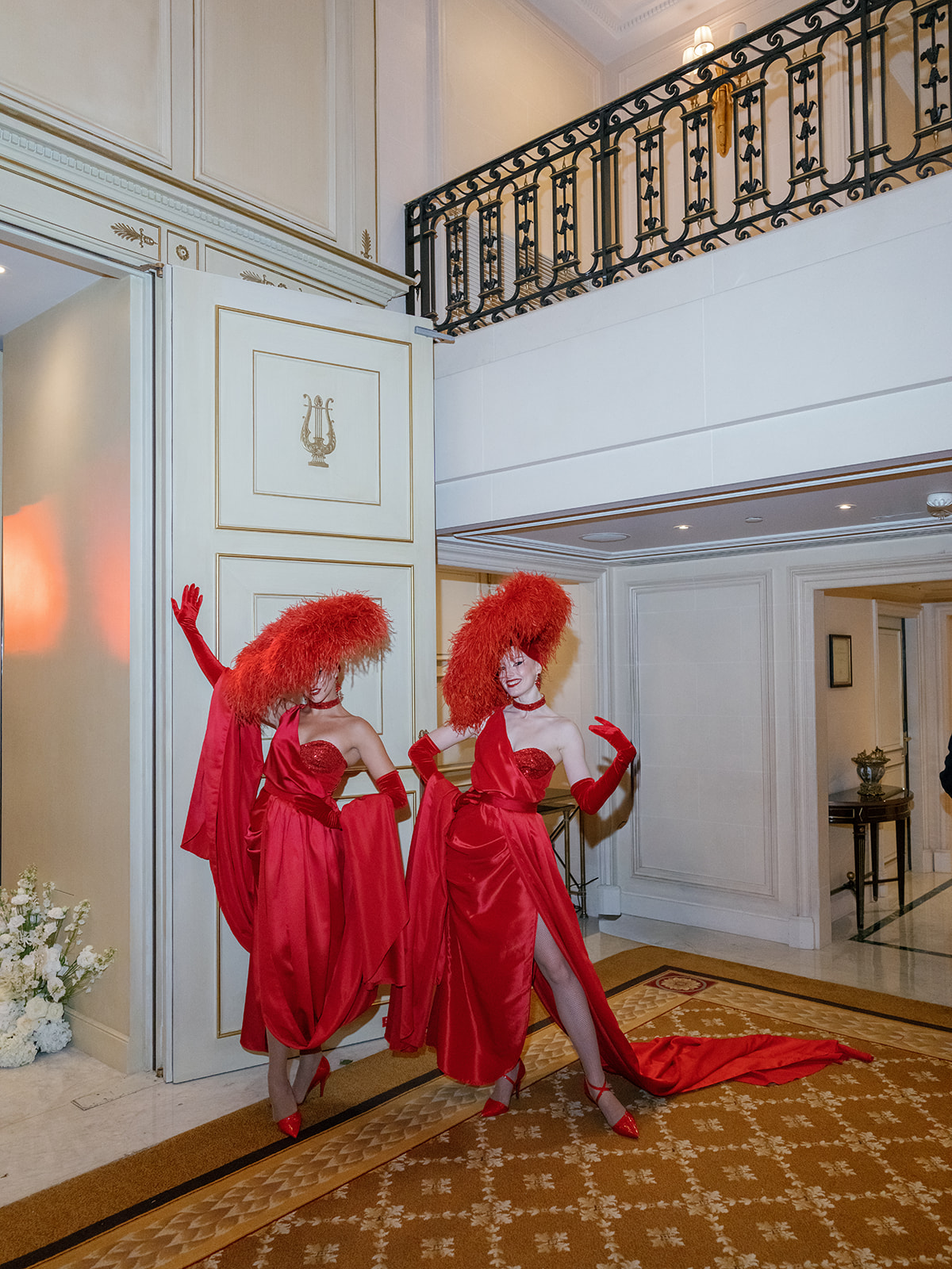 Two dancers in red gowns performing during a luxury wedding dinner at Shangri-La Paris