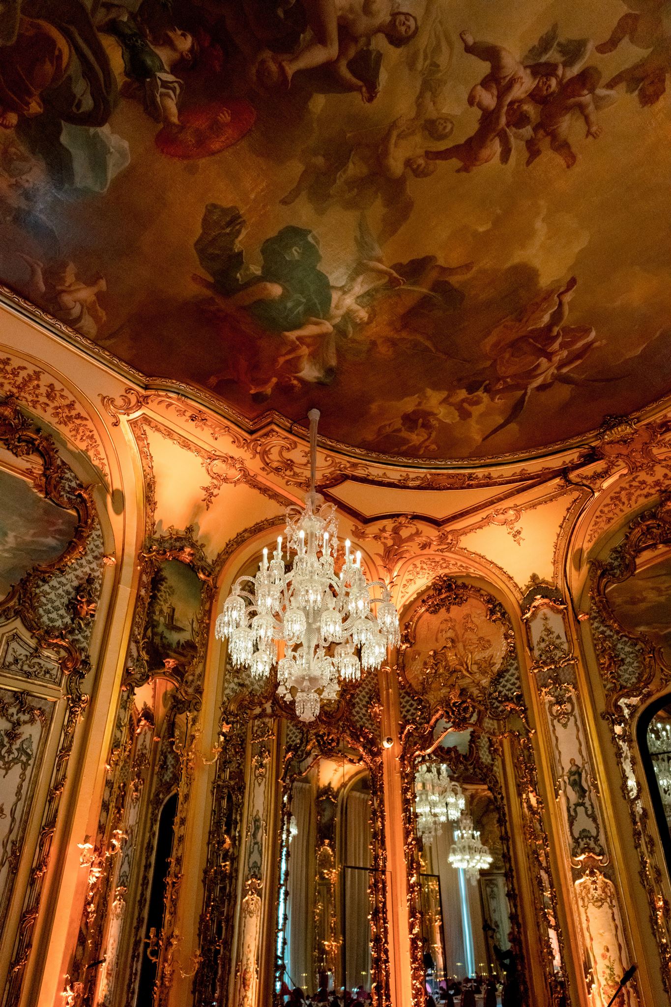 Painted ceiling and crystal chandelier in the historic salons at Shangri-La Paris