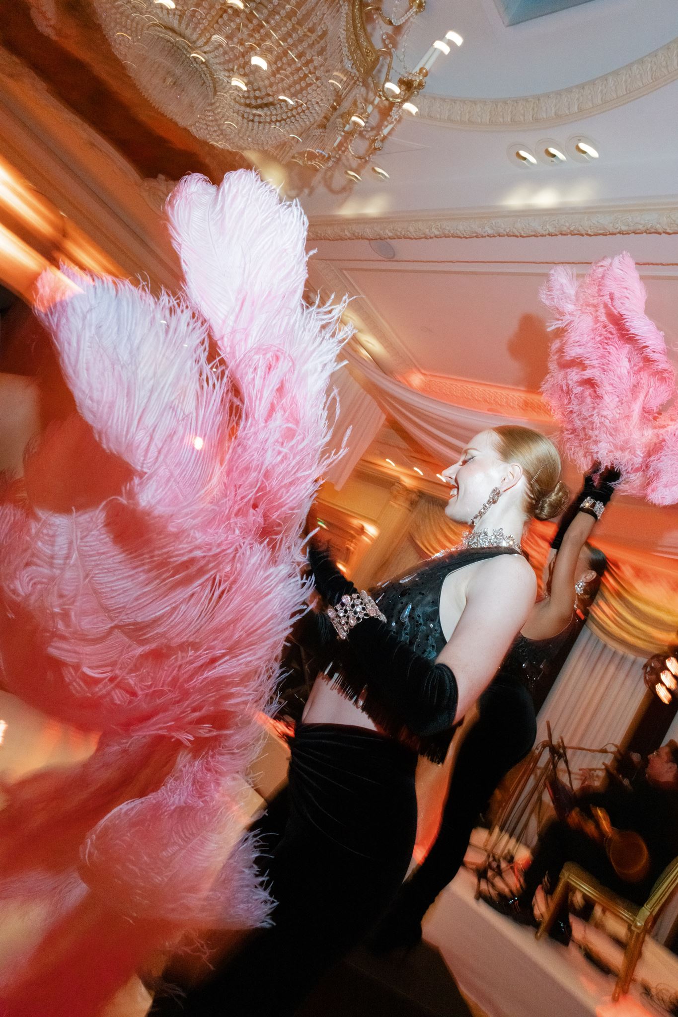 Pink feather performance during the evening wedding reception at Shangri-La Paris