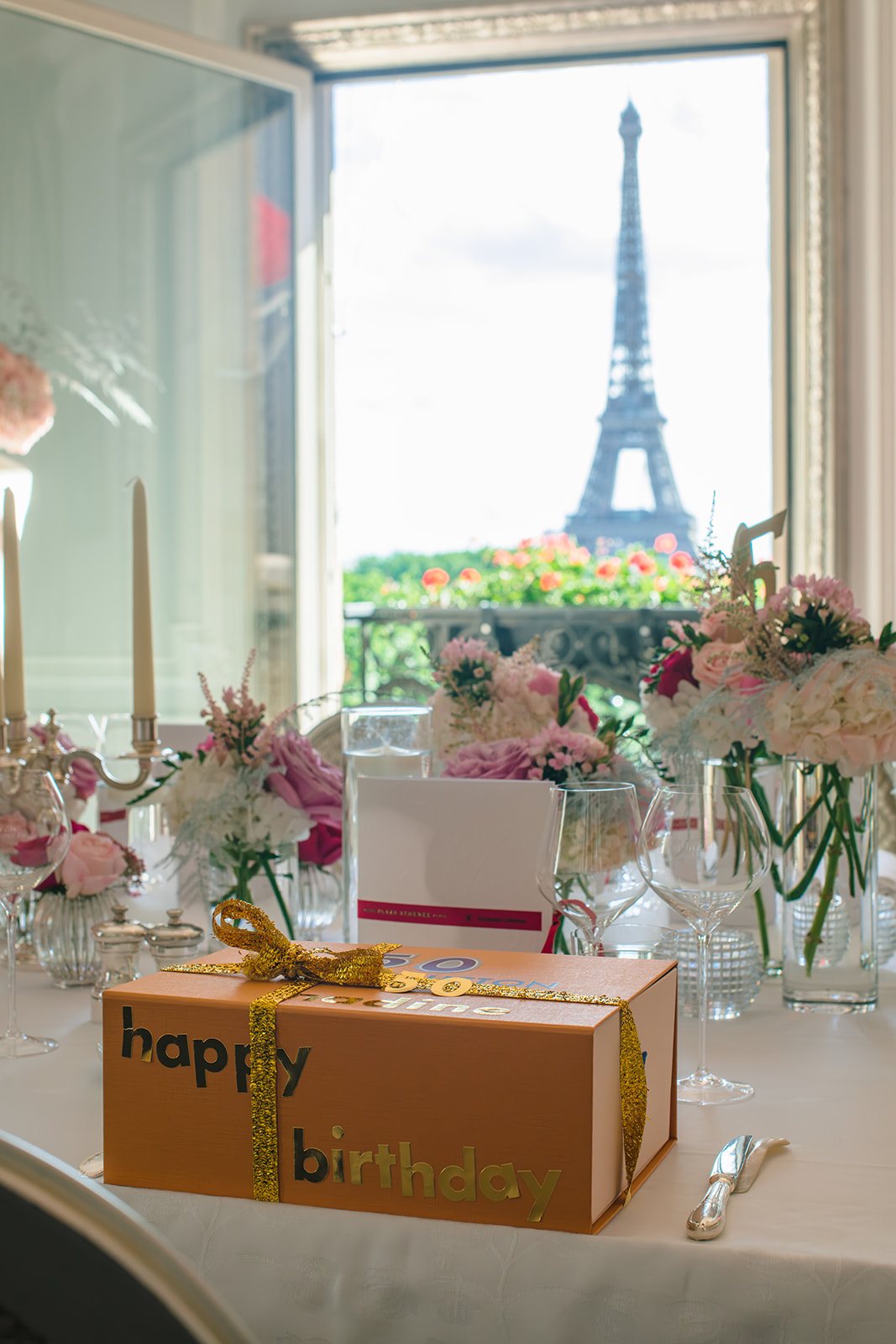 Private birthday table inside the Haute Couture Eiffel Suite with an Eiffel Tower view