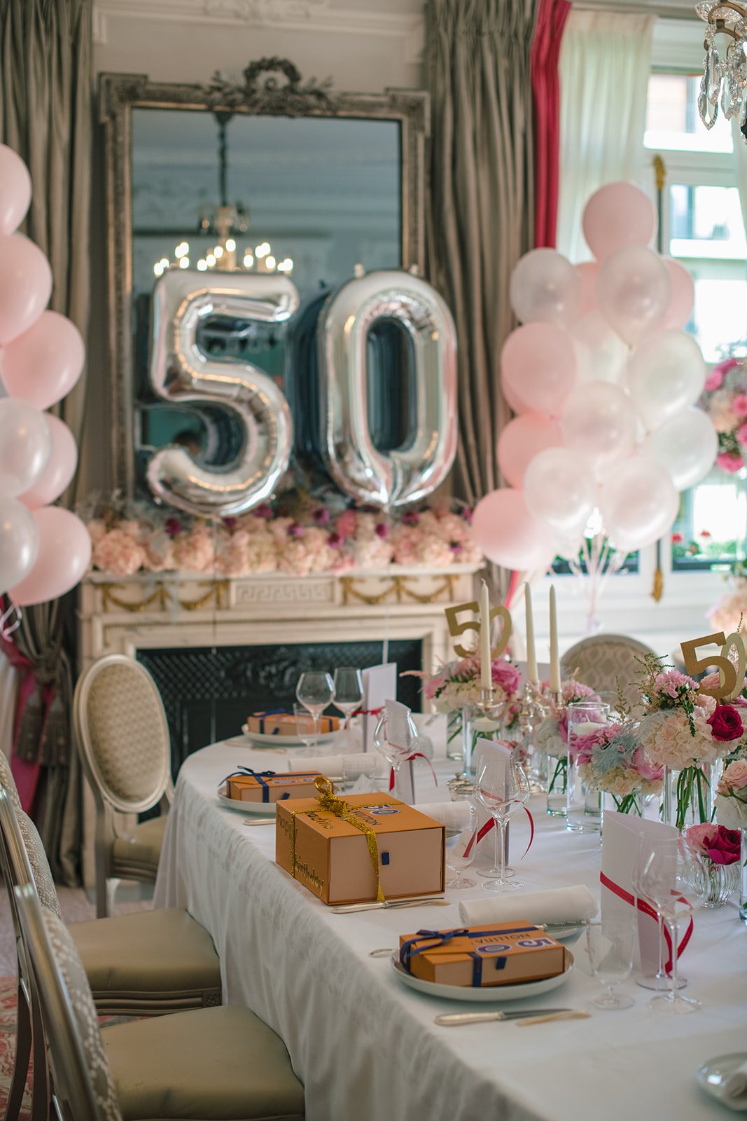 Floral table design and silver 50 balloons for a private birthday at Hôtel Plaza Athénée