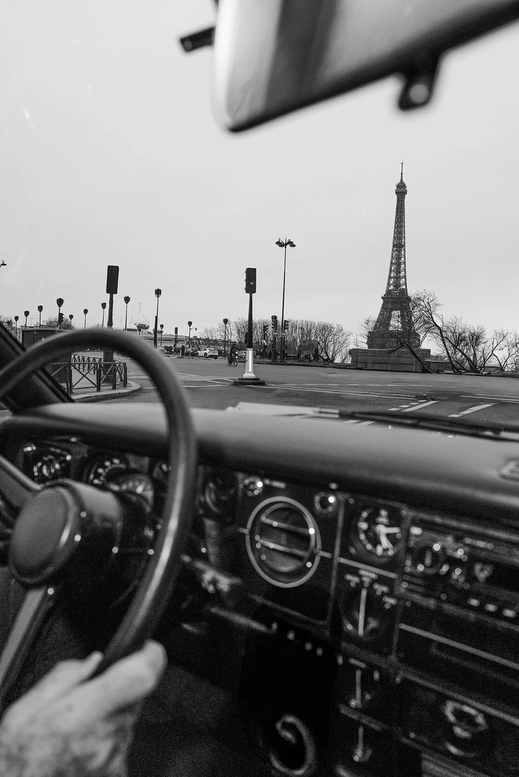 Rolls-Royce beside the Eiffel Tower during a Paris destination wedding