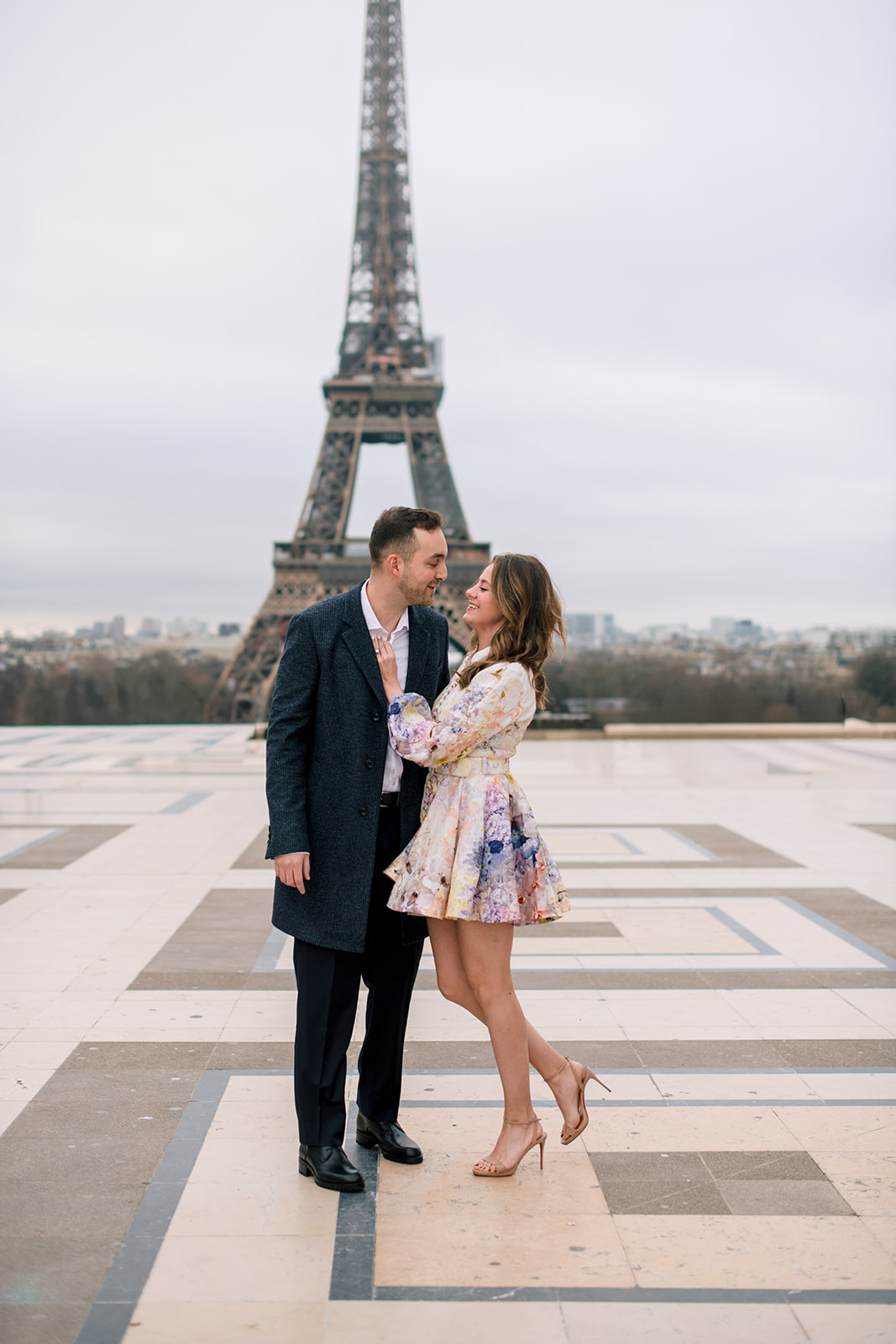 American couple photographed at the Eiffel Tower before their wedding in Switzerland