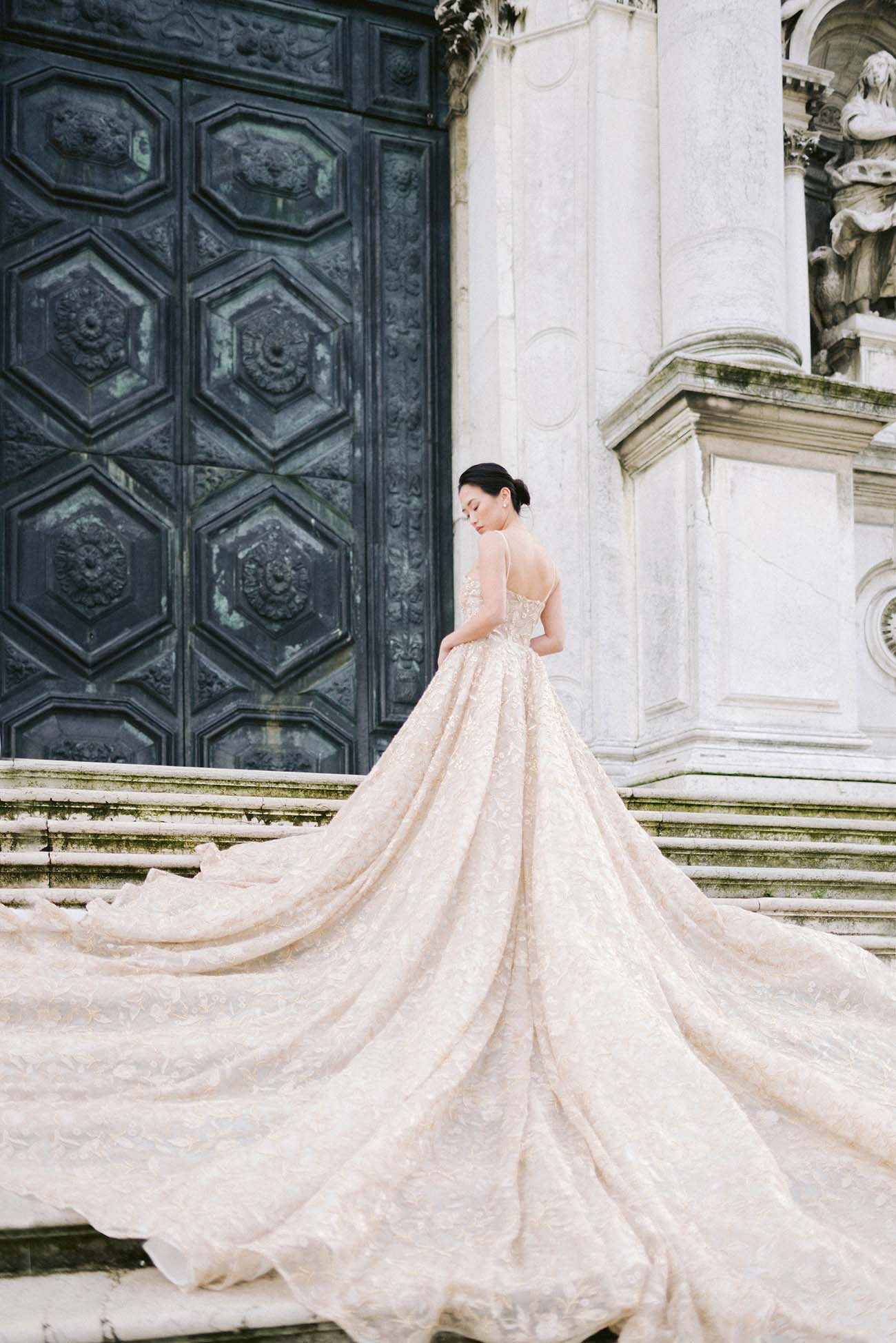 a bride poses on the basilica maria di santa step