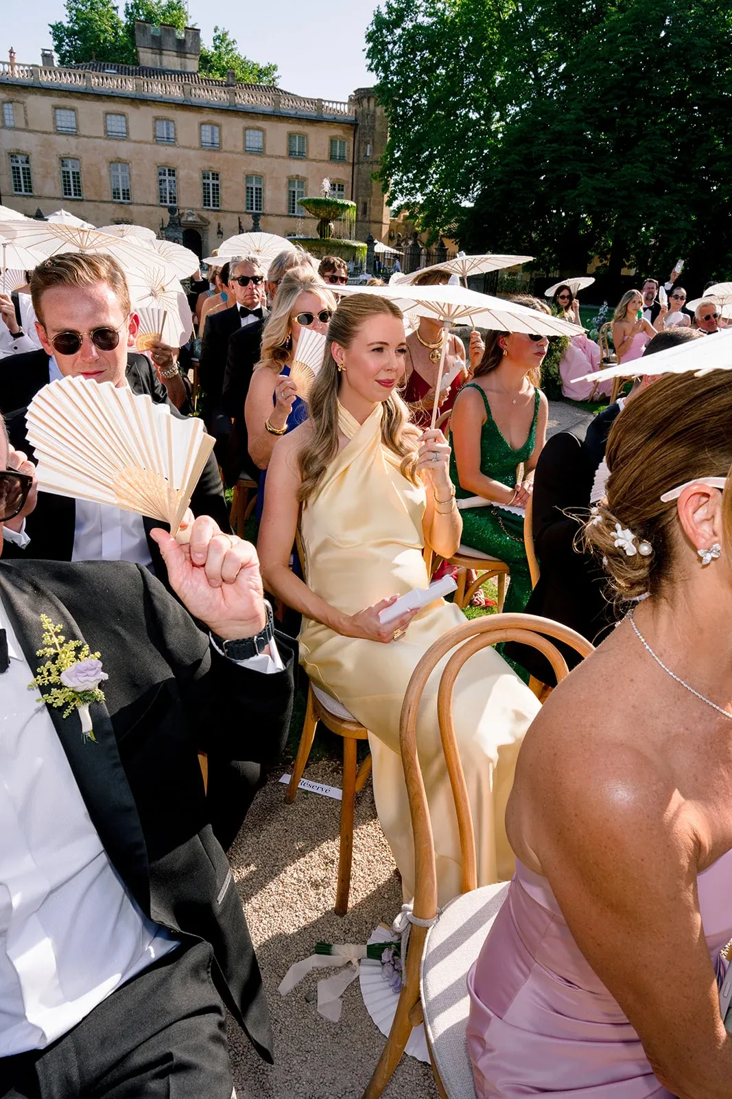 Wedding guests attending an outdoor ceremony at Villa Baulieu