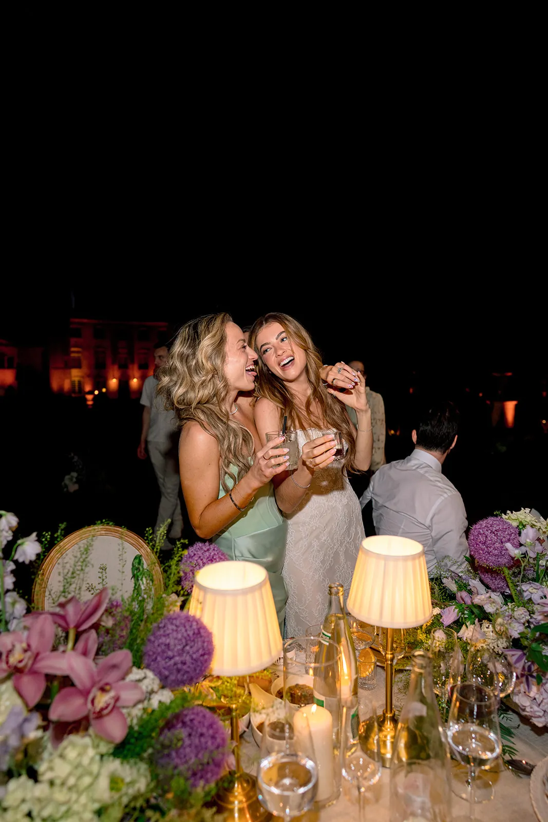 Bride and friend taking a selfie during the evening reception at Villa Baulieu