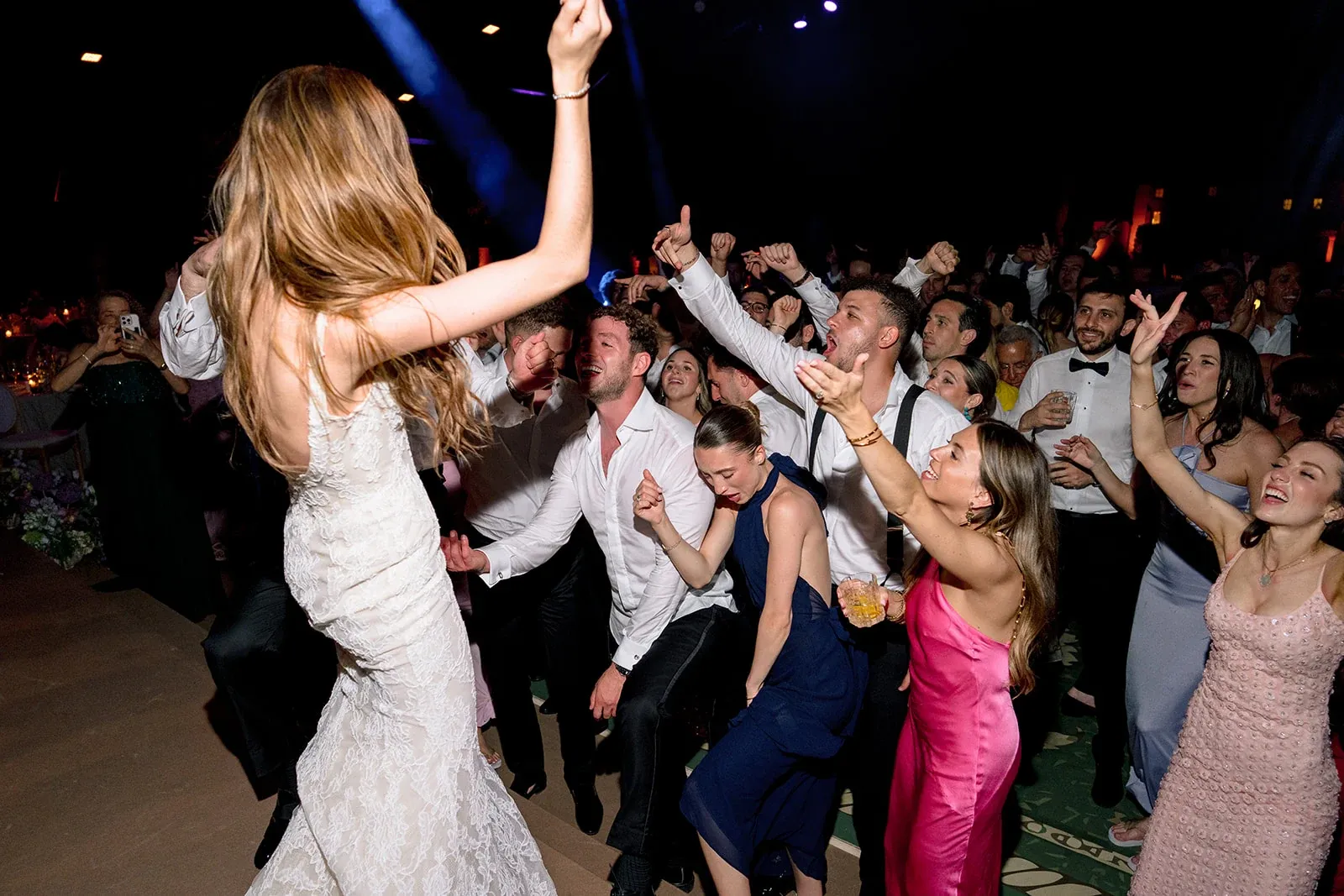 Bride leading the celebration on the packed dance floor at Villa Baulieu