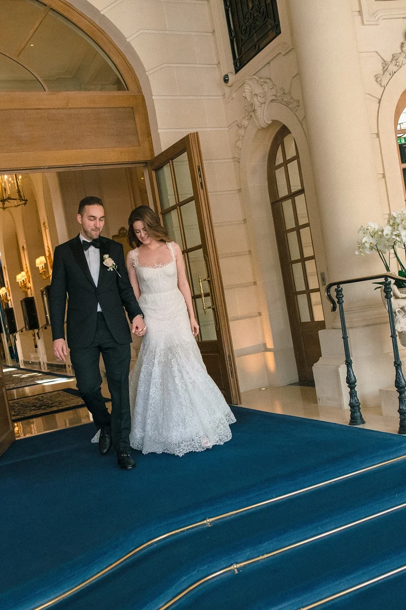 Bride and groom descending the entrance steps at the Ritz Paris