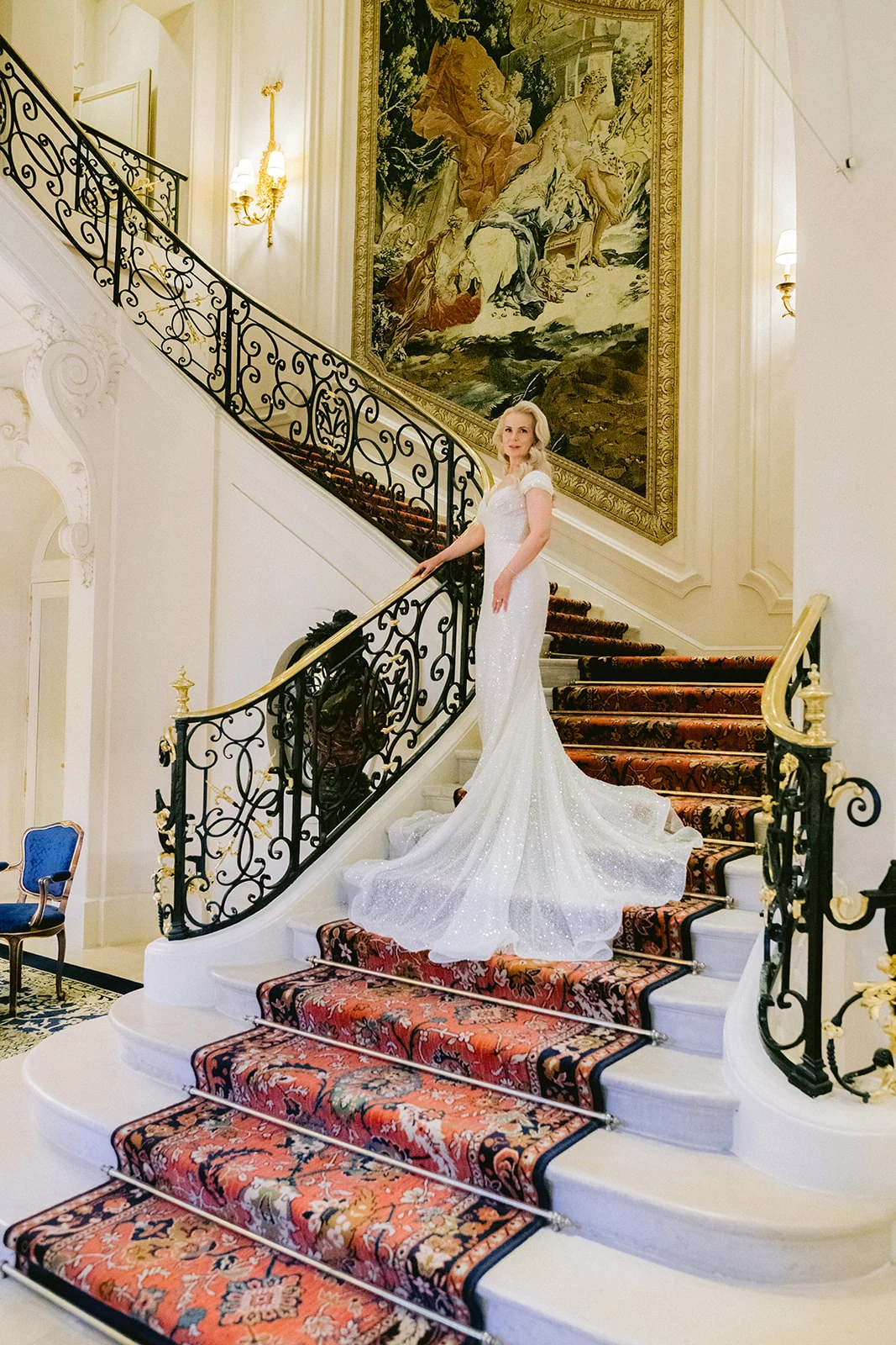 Bridesmaids walking through the elegant lobby of The Ritz Paris