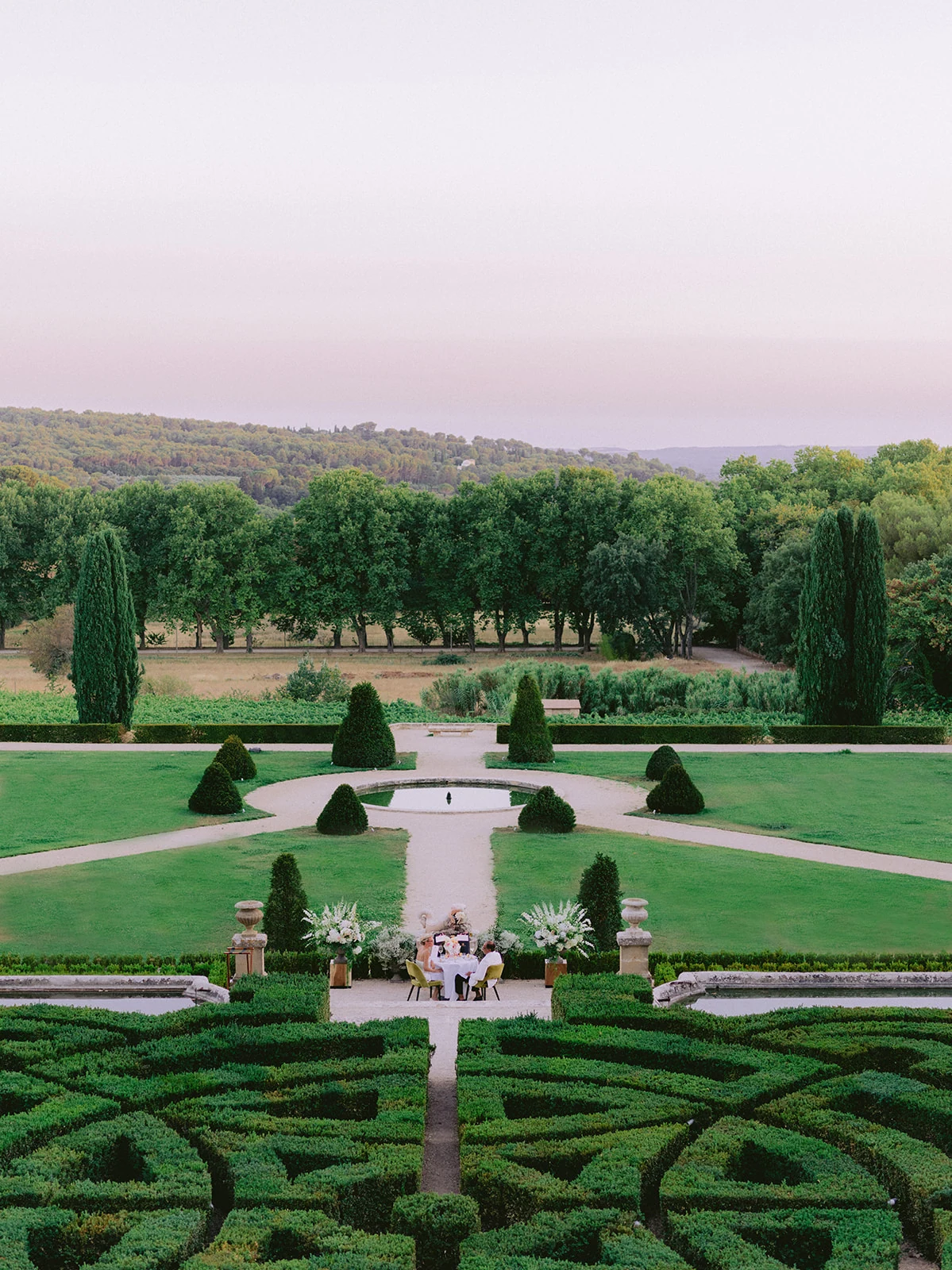 Romantic private dinner in the château gardens at sunset