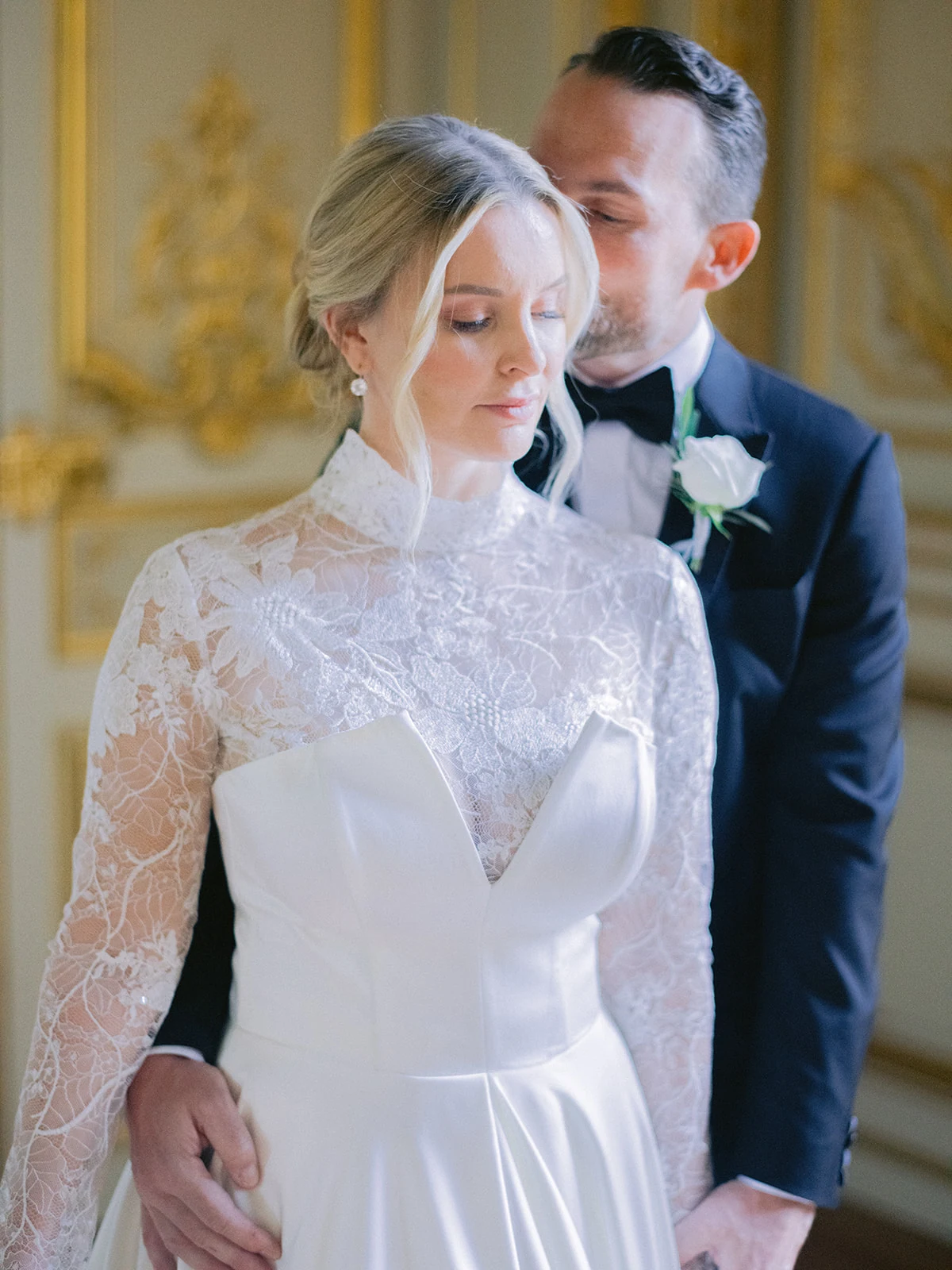Bride and groom embracing inside Shangri-La Paris