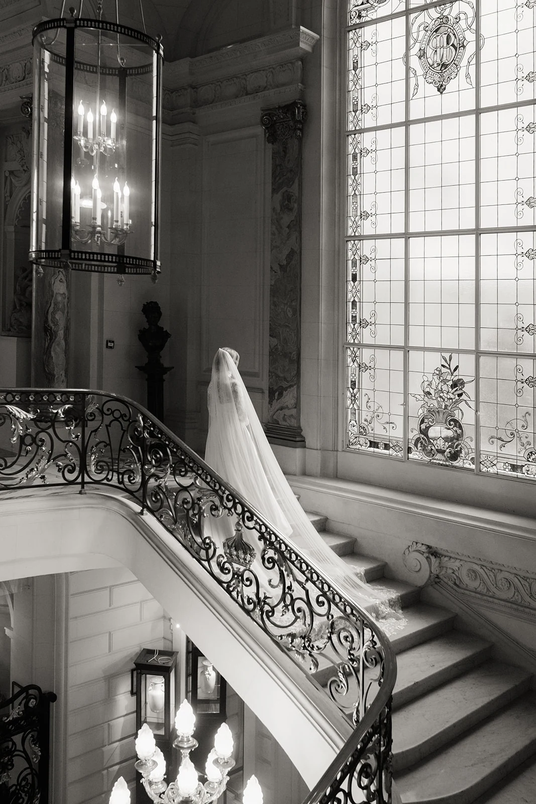 Bride photographed alone on the Shangri-La Paris staircase