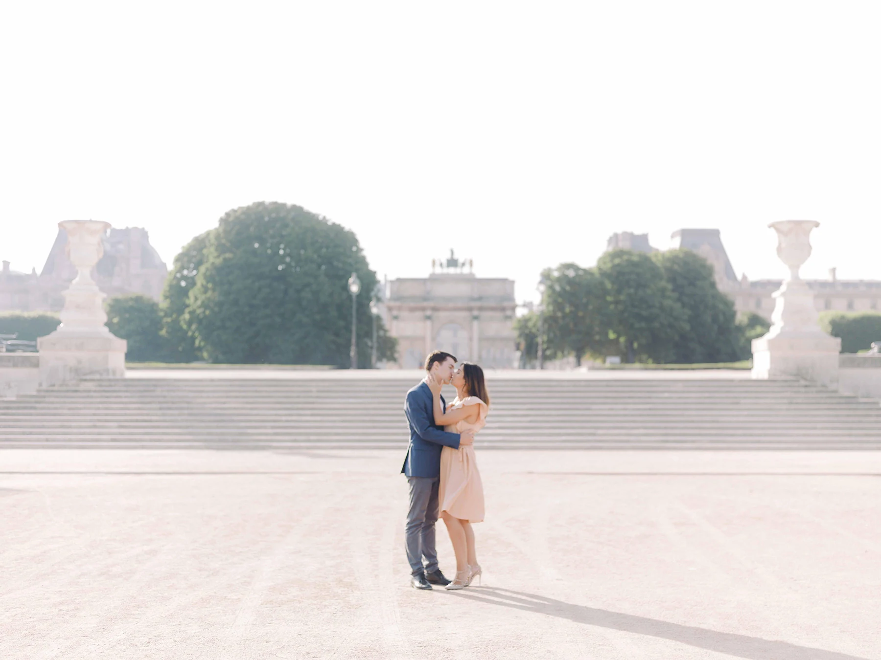 Couple during an engagement session in Paris with an Eiffel Tower view