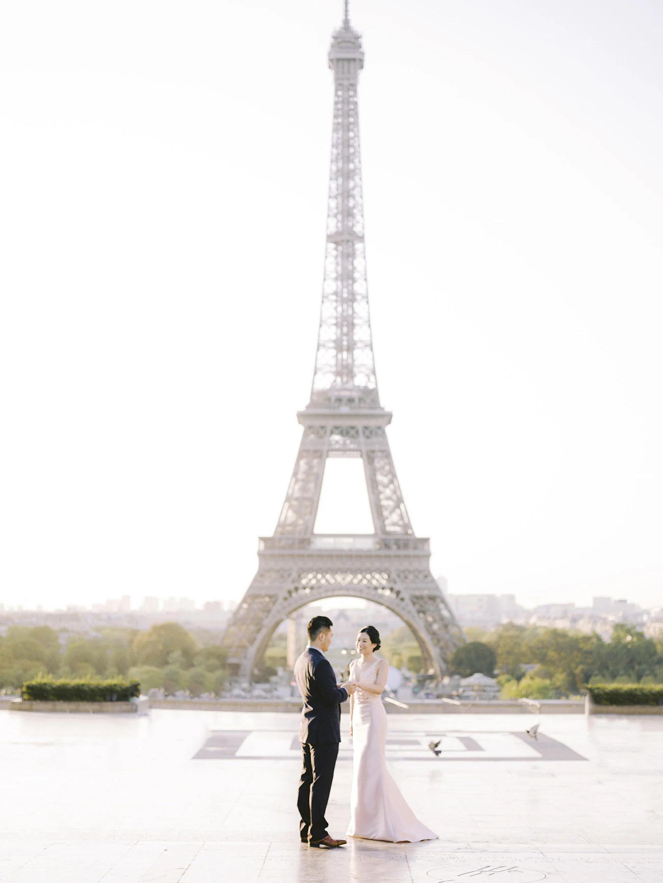 Japanese couple during a surprise proposal at the Eiffel Tower in Paris