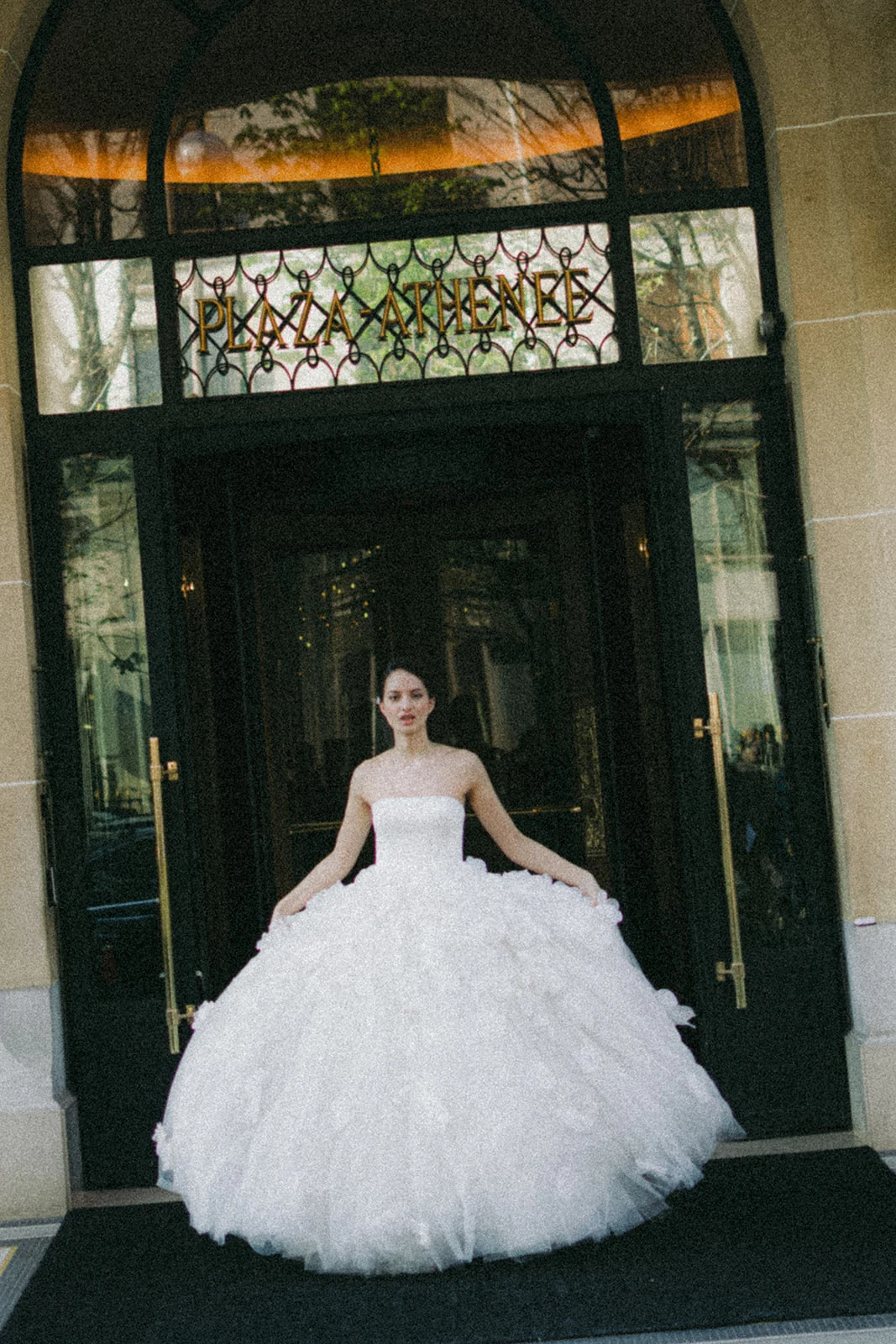 Bride in front of Plaza Athénée Paris entrance