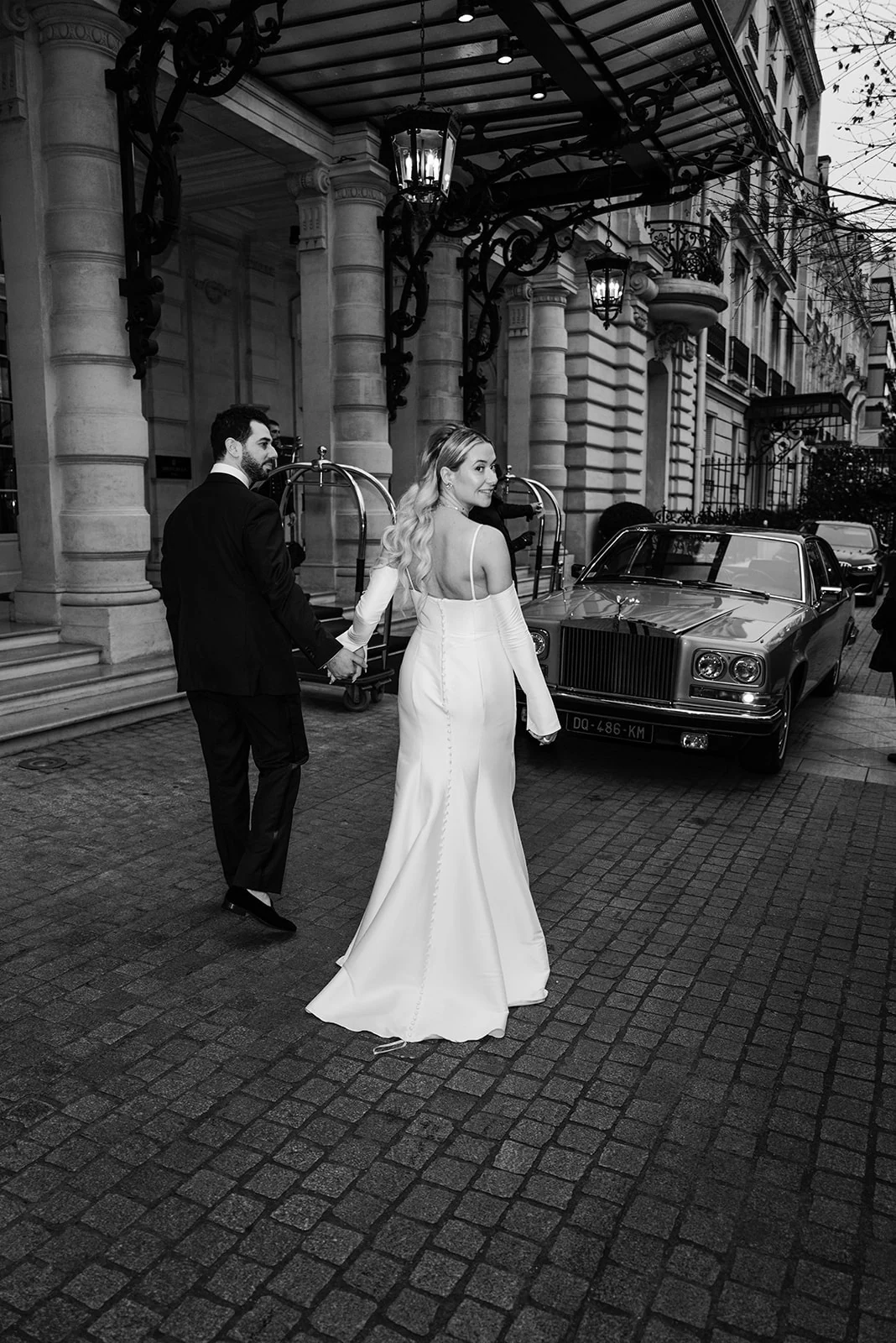 Bride and groom leaving a full wedding at Shangri-La Paris