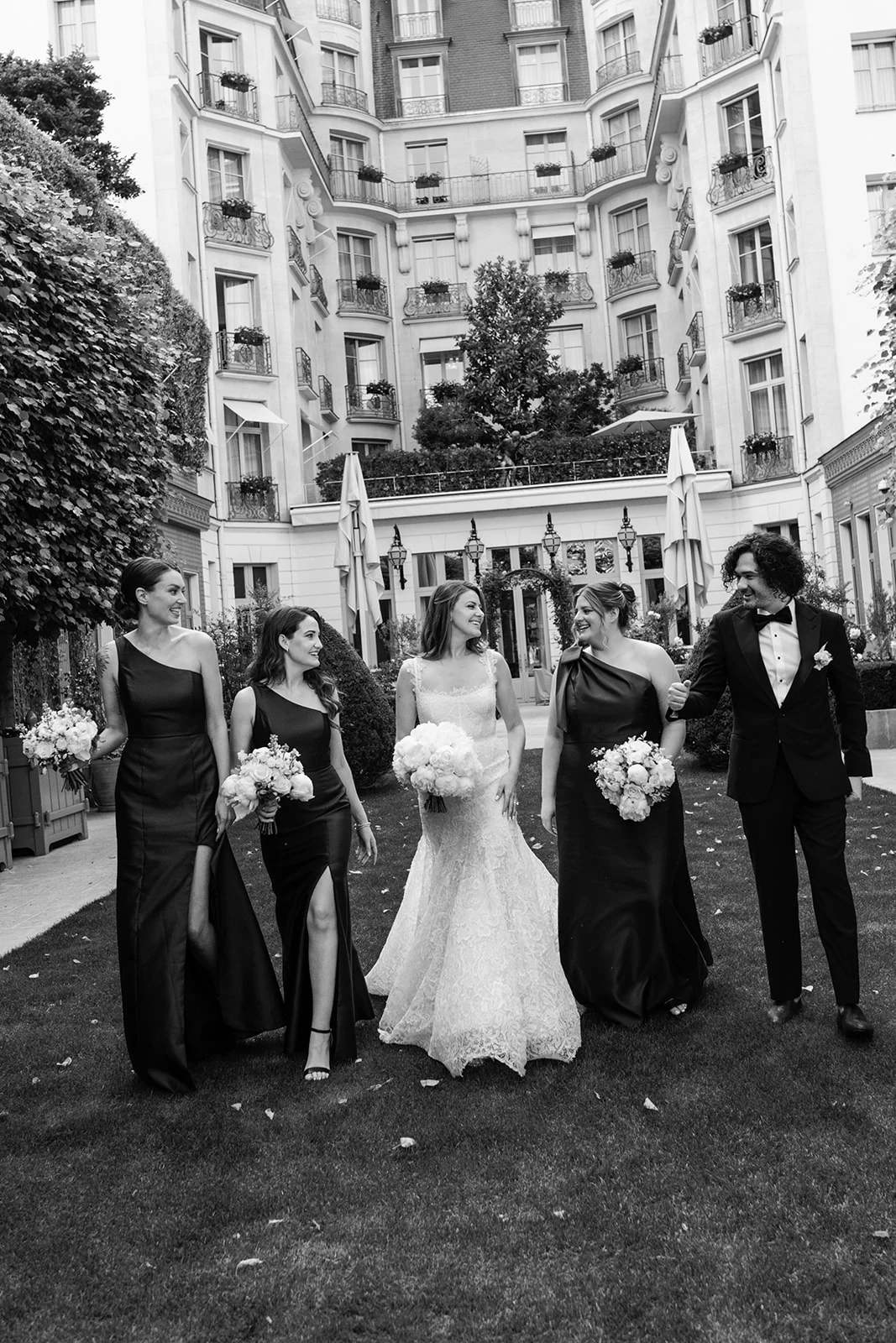 Black-and-white wedding party portrait in a Paris street