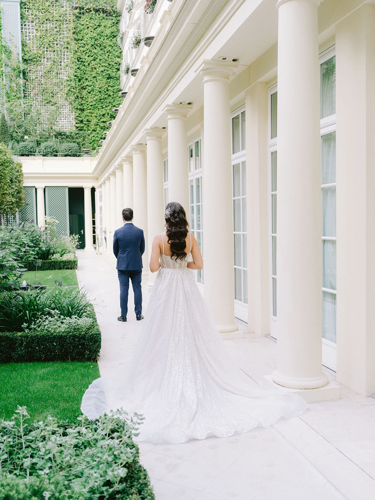Bride and groom first look in the garden at Le Bristol Paris