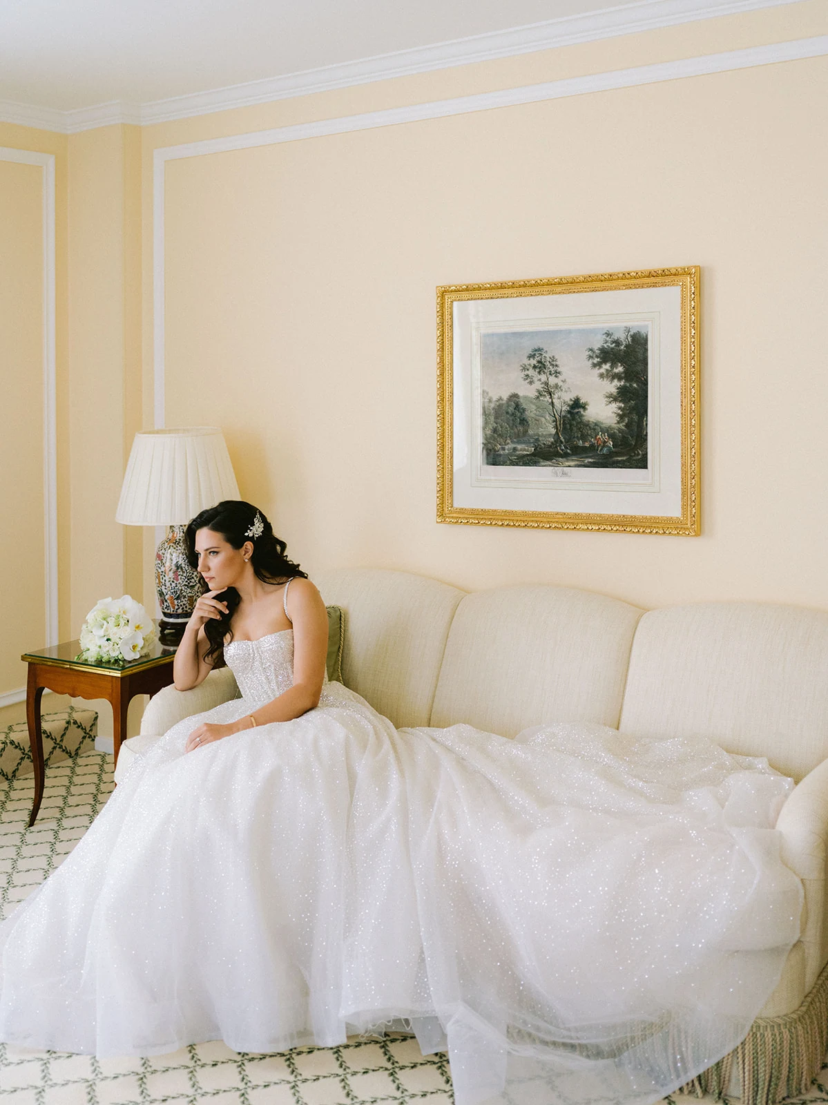 Bride getting ready in a Berta wedding dress at Le Bristol Paris