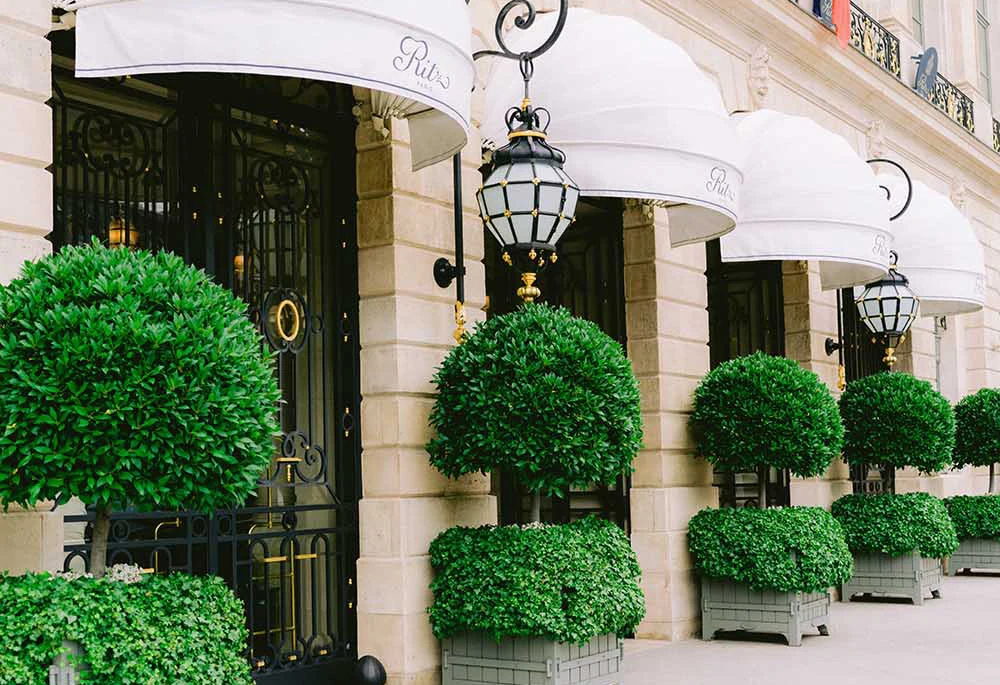 Bride and groom photographed outside the Ritz Paris on Place Vendôme