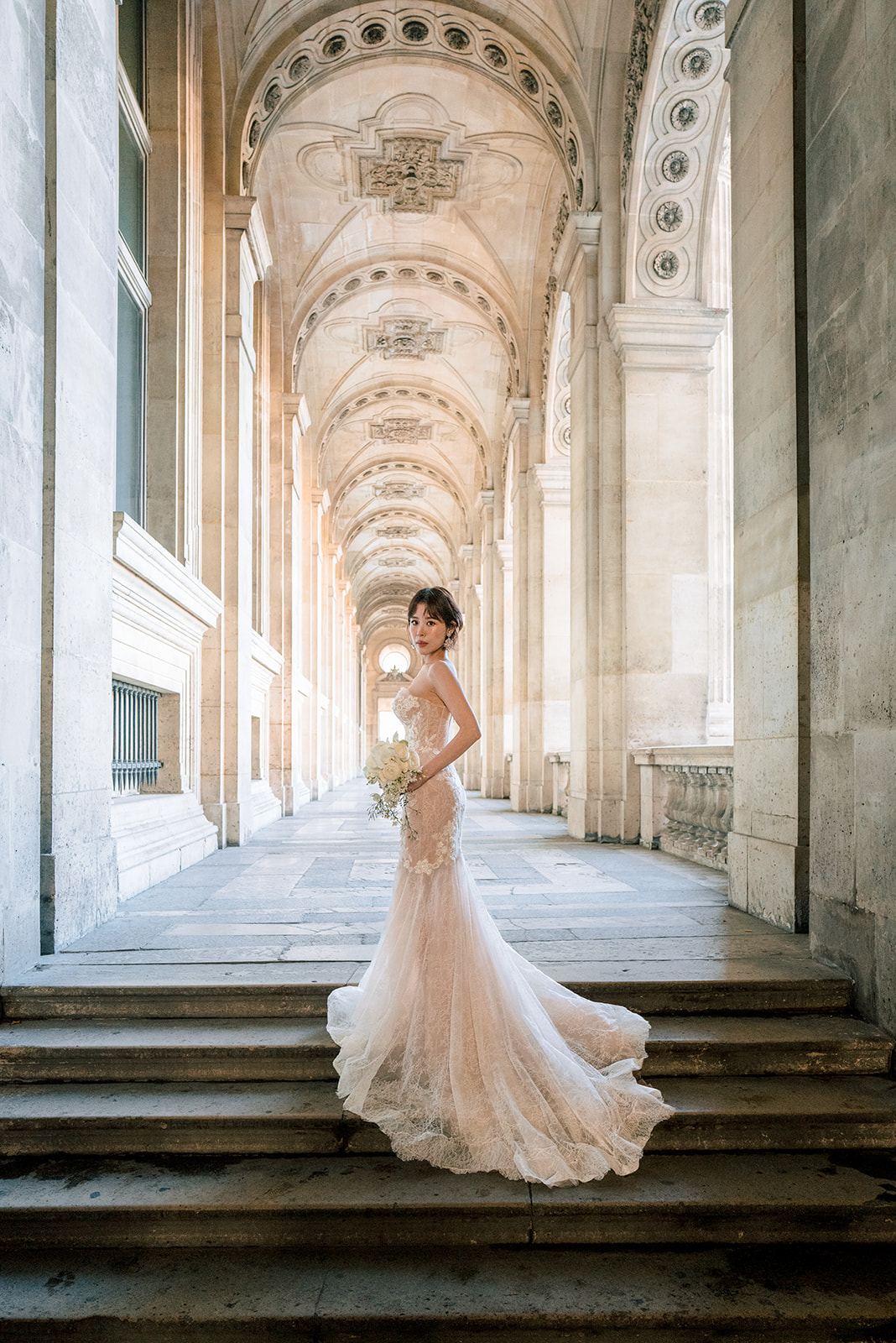 Asian couple photographed during a Paris pre-wedding session near the Louvre