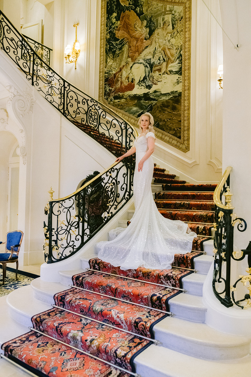 Bridesmaids walking through the elegant lobby of The Ritz Paris