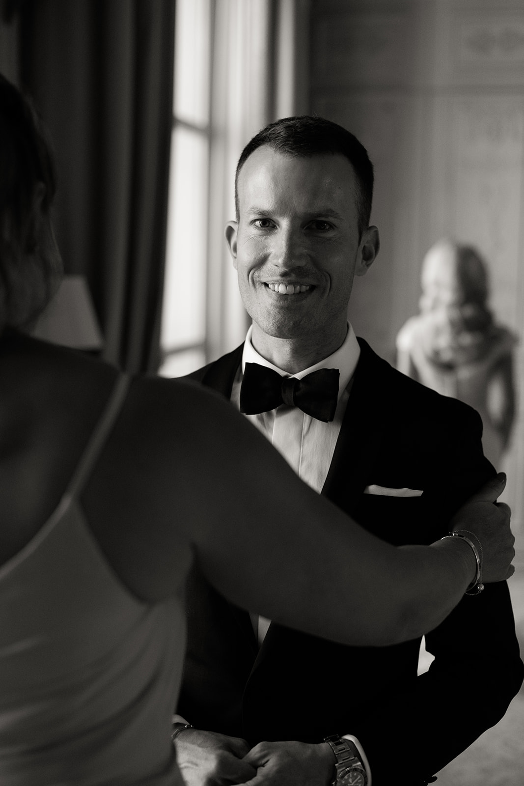 Groom during an emotional first look at The Ritz Paris in black and white