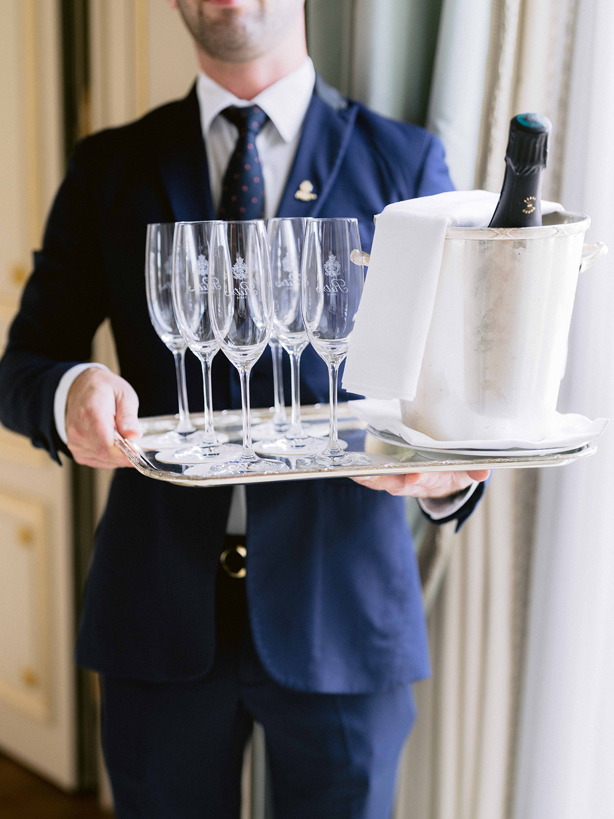Champagne service presented for an elegant wedding celebration at The Ritz Paris
