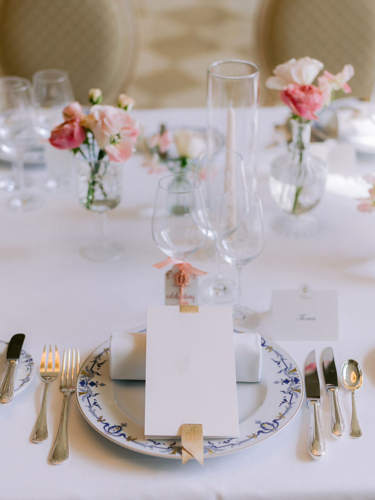Elegant wedding table setting with fine china and flowers at The Ritz Paris