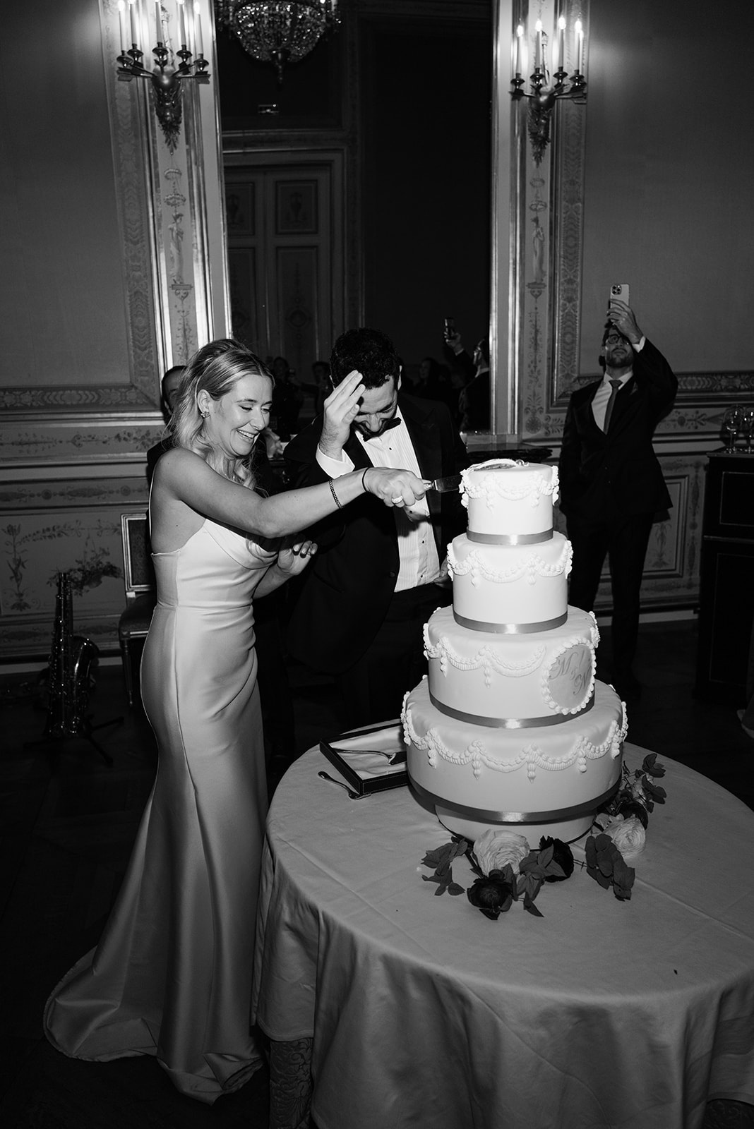 Bride and friend dancing together during the Shangri-La Paris wedding party