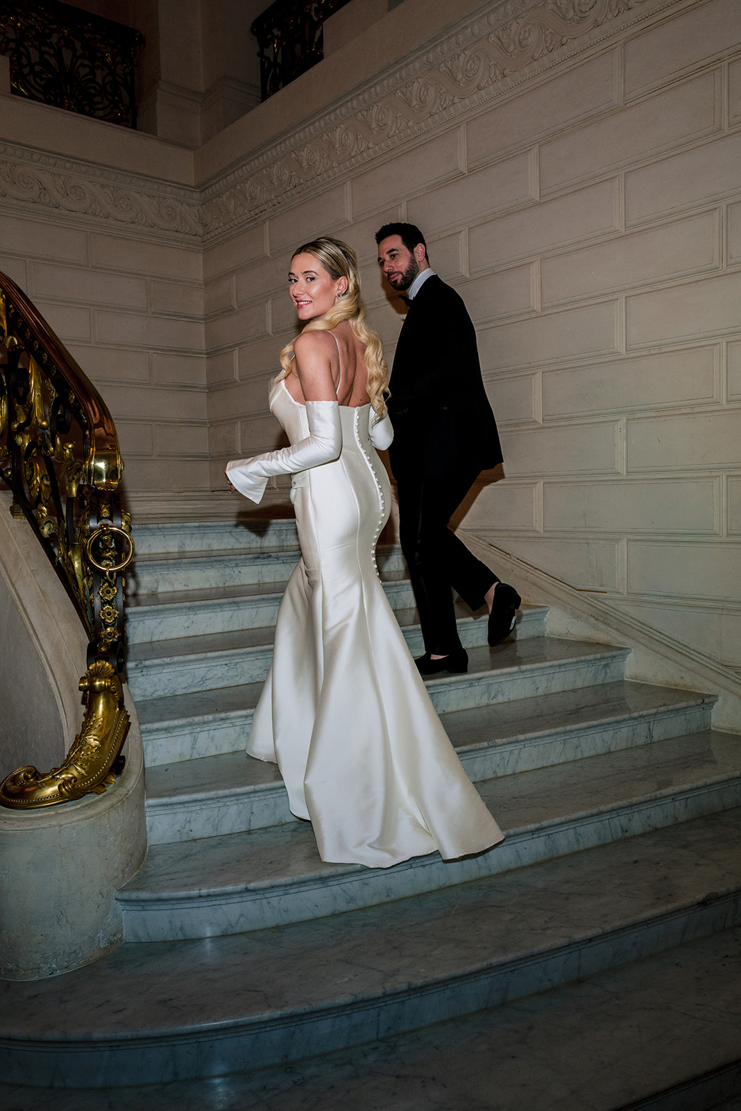 bride and groom on the iconic stairs at the shangri-la