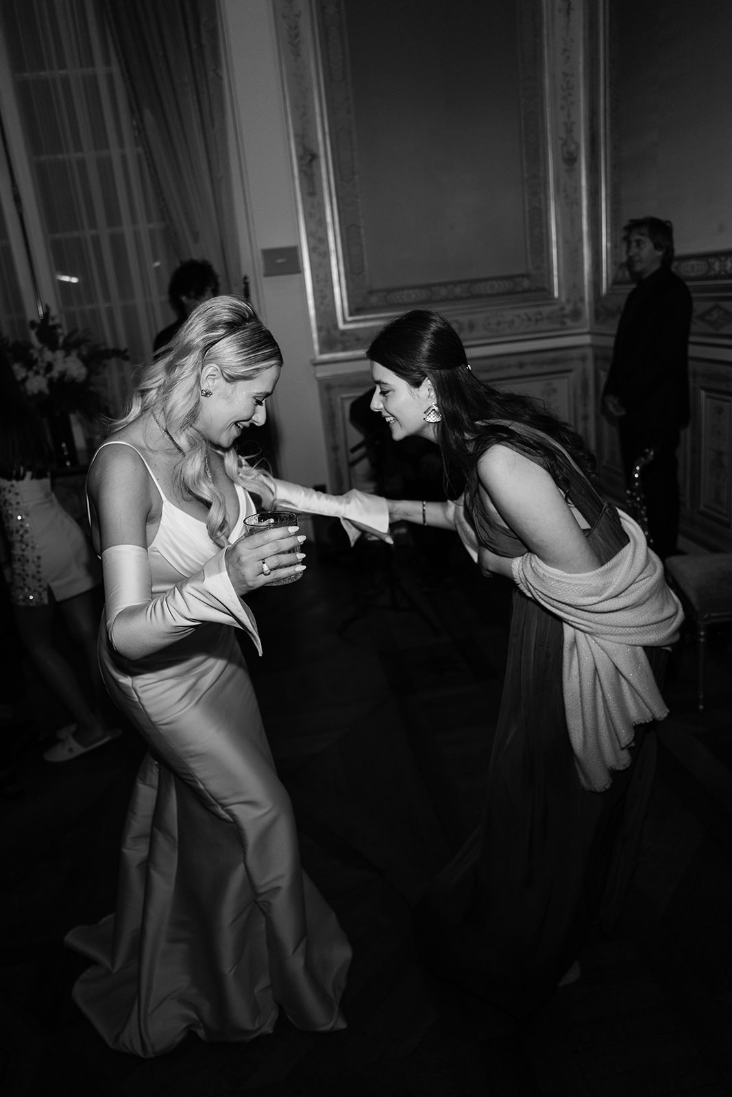 Bride dancing with a young guest during the Shangri-La Paris wedding reception